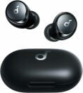a pair of black anker space a40 earbuds with charging case on a white background