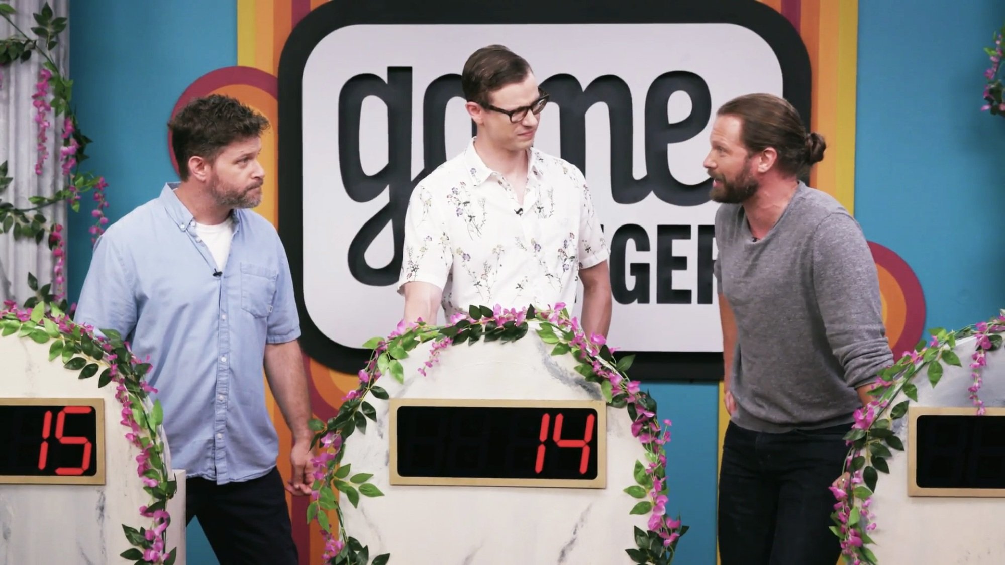 Three game show contestants perform an improvised Shakespeare scene.