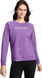 Woman wears purple Peloton crewneck sweater