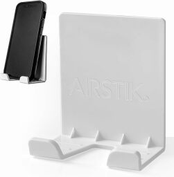 A white AIRstik, a small plastic cradle.