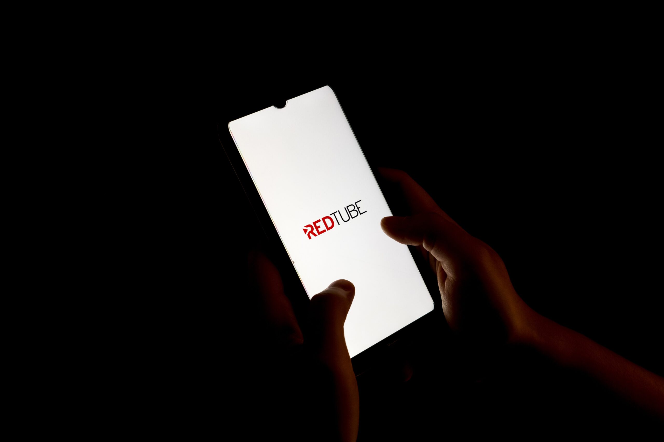 Redtube logo displayed on a smartphone screen