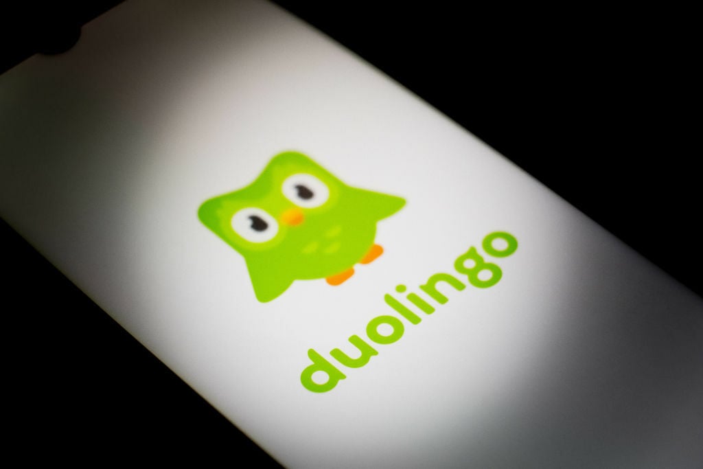 The Duolingo logo displayed on a smartphone.