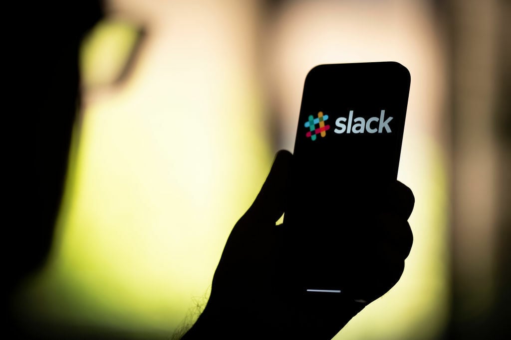 slack logo on phone being help