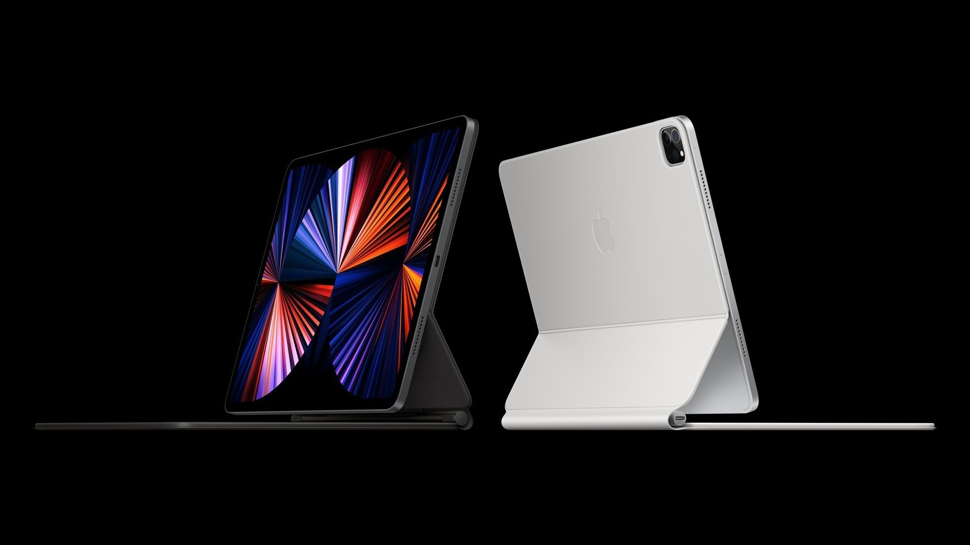 two apple ipad pros in desktop mode amidst a black background
