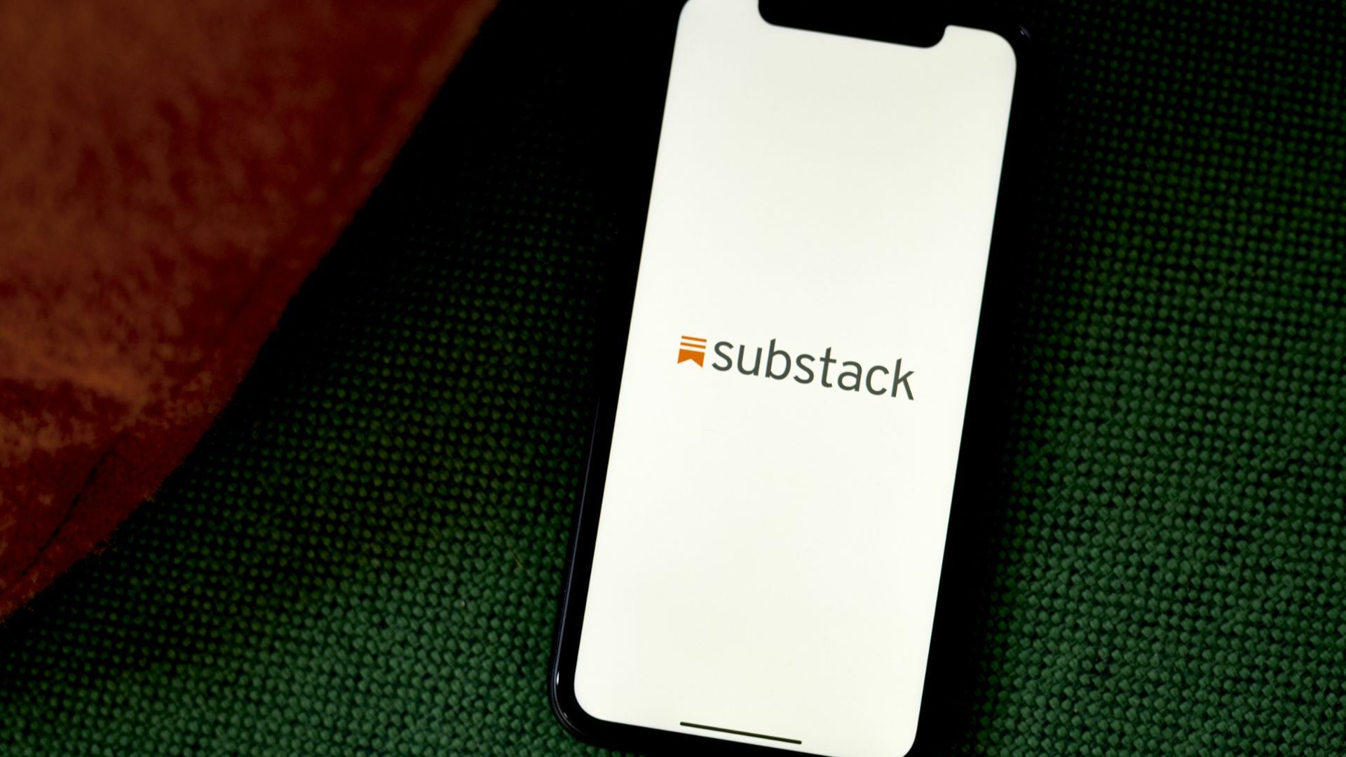 The Substack logo on a smartphone.