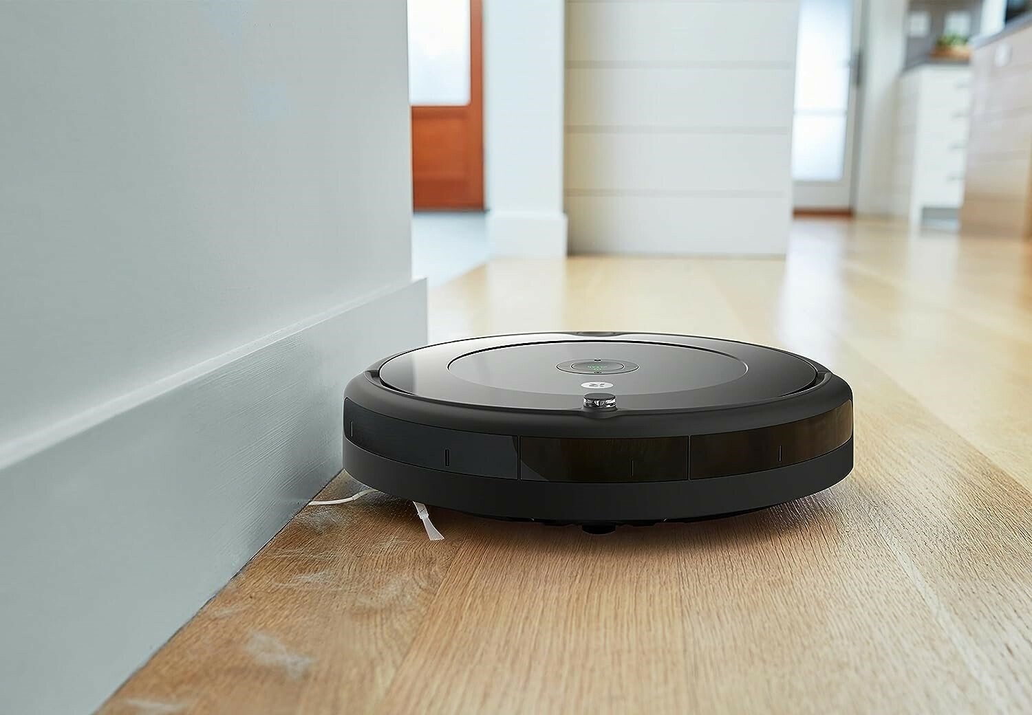 The iRobot Roomba 694 robot vacuum sweeping up pet hair