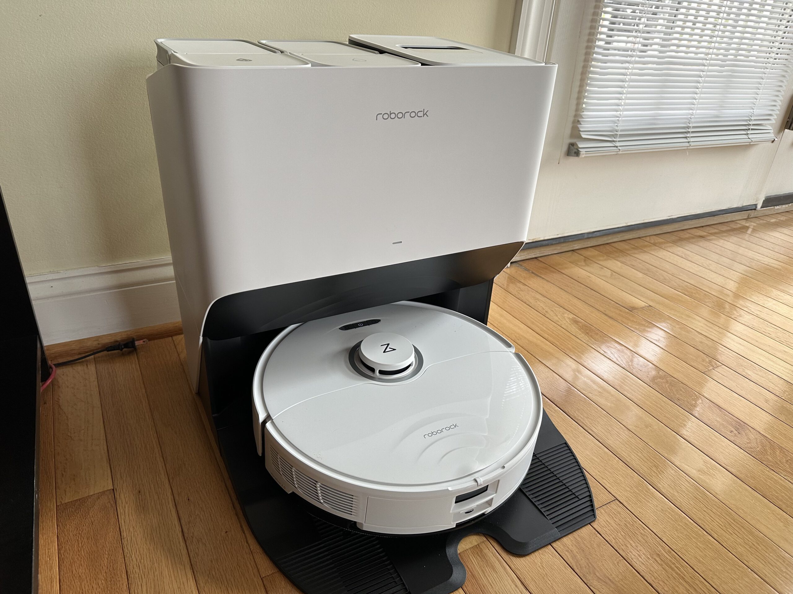 The Roborock S8 Pro Ultra in a white color, resting on its recharging base