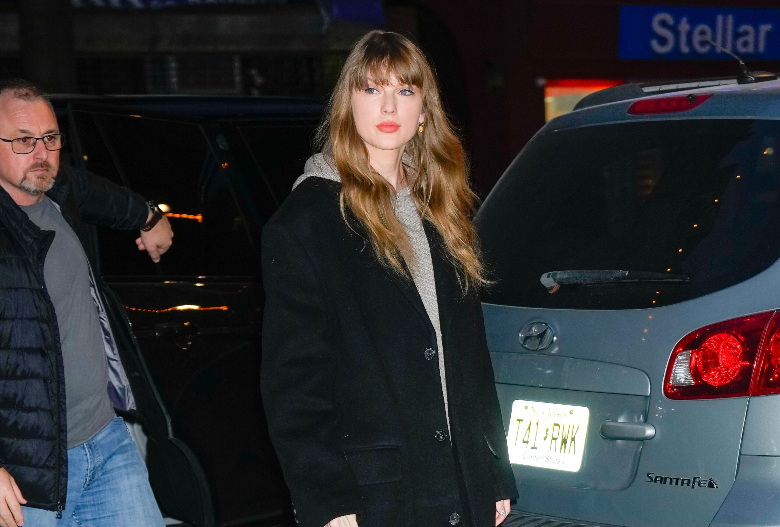 Taylor Swift in a black coat in New York City