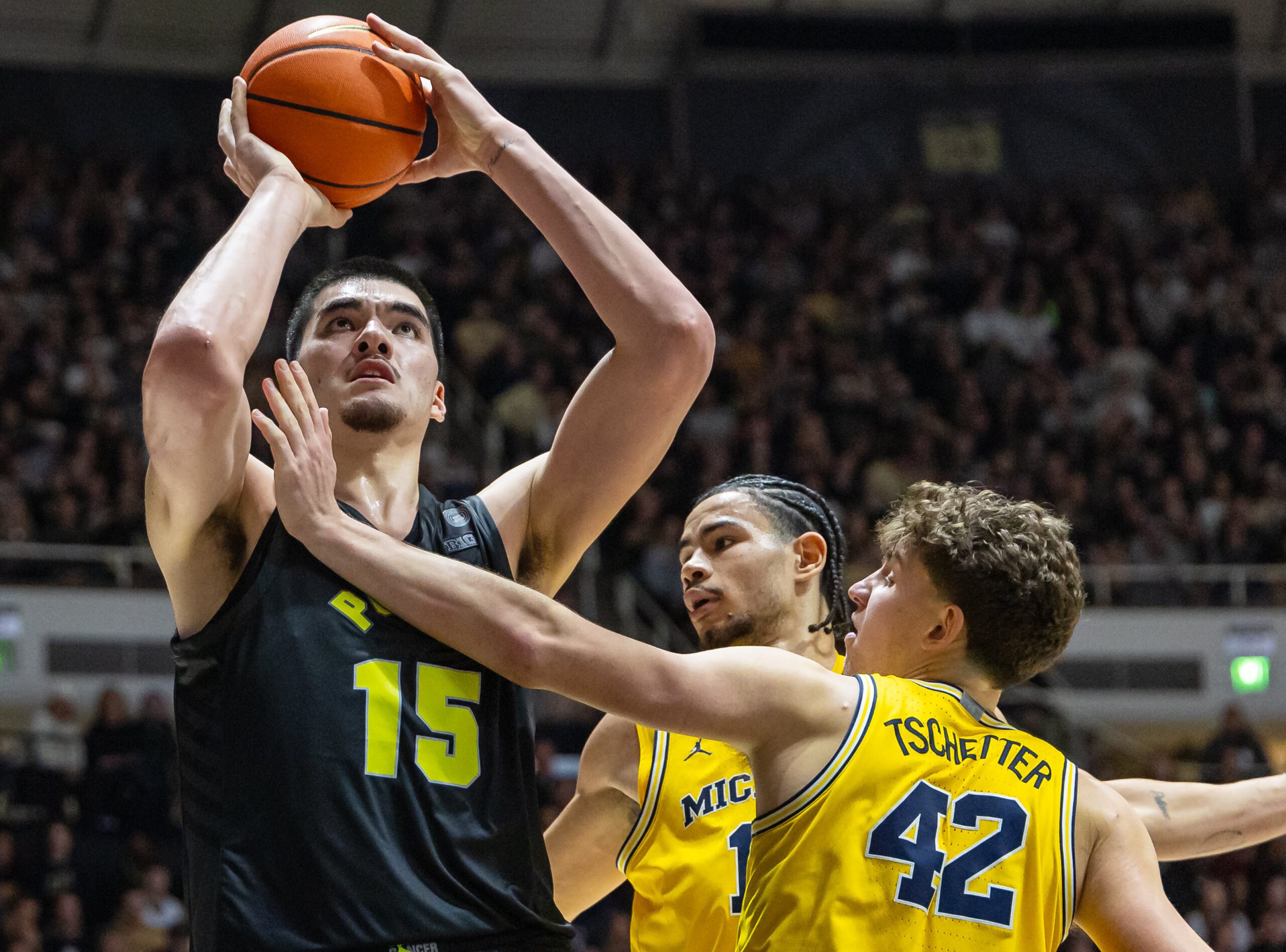 Zach Edey of the Purdue Boilermakers shoots the ball against Will Tschetter of the Michigan Wolverines during the second half at Mackey Arena on January 23, 2024, in West Lafayette, Indiana.