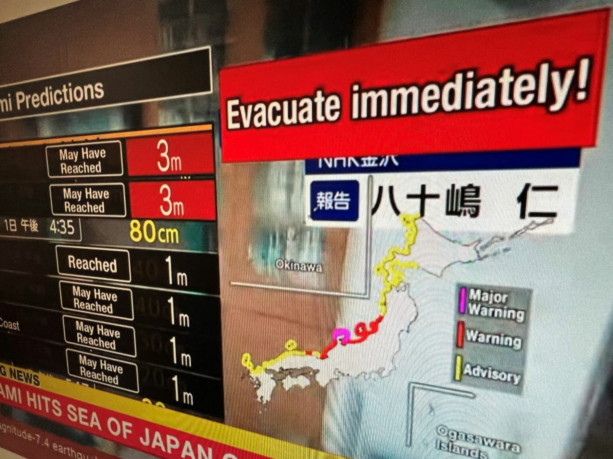 A warning message on a screen from a live feed on NHK World asking people to evacuate from the area after a series of major earthquakes hit central Japan.