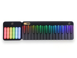 A popupiano in black with colorful keys