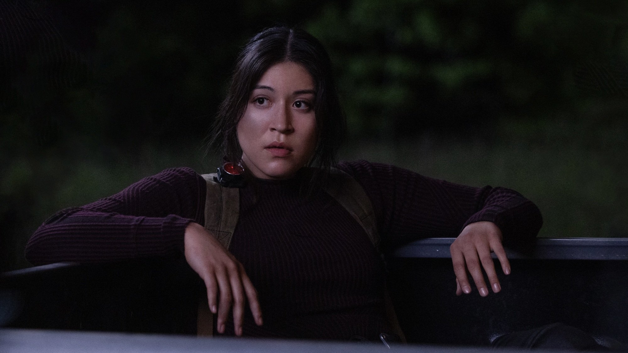Maya Lopez sits in a truck bed.