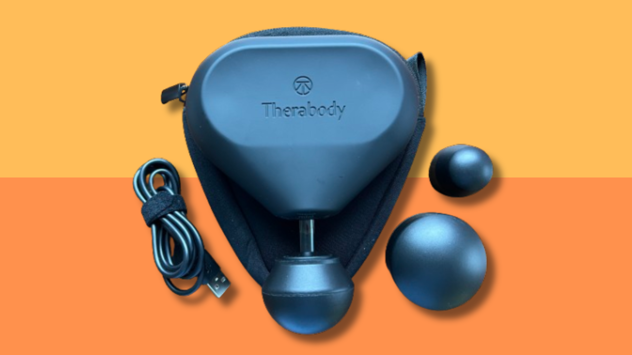 theragun mini with charging cord and additional massage heads 