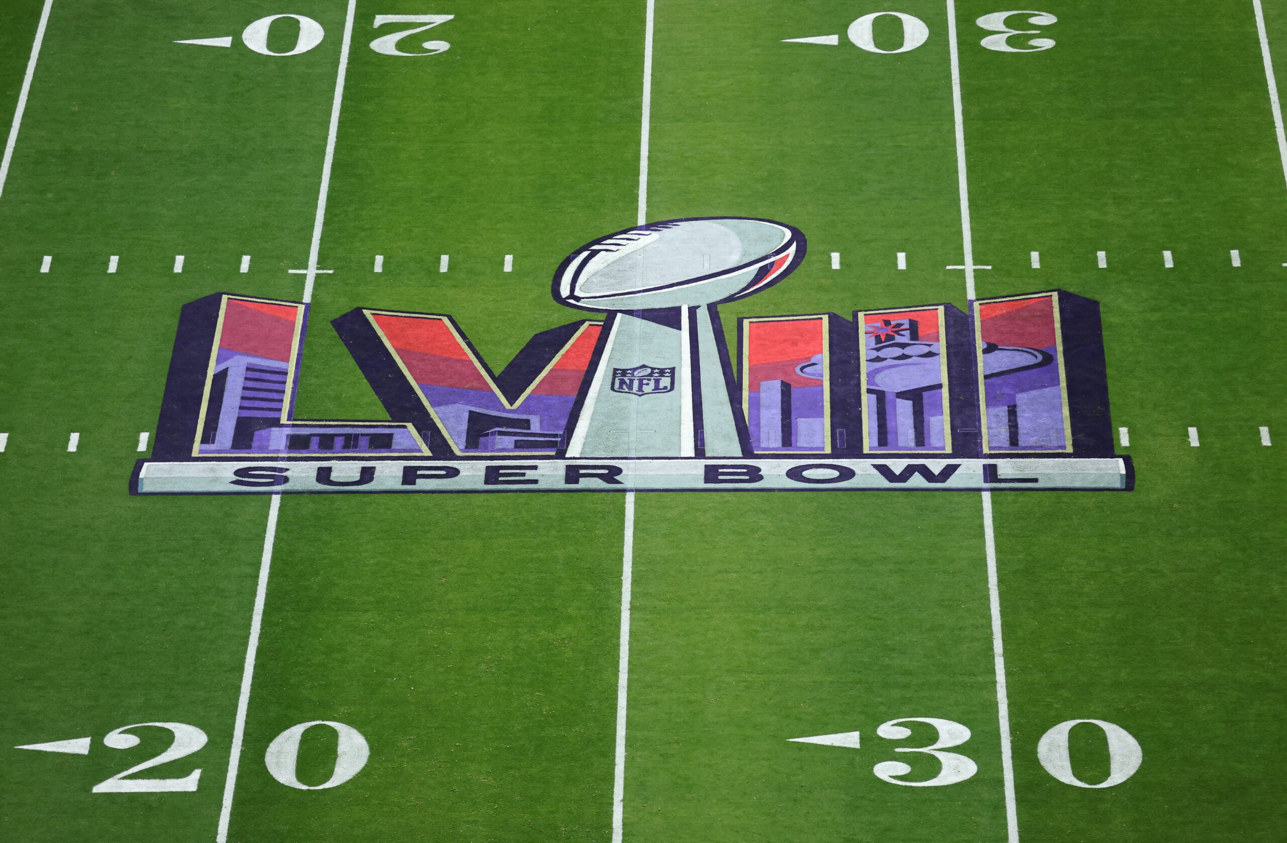Super Bowl logo on the field.