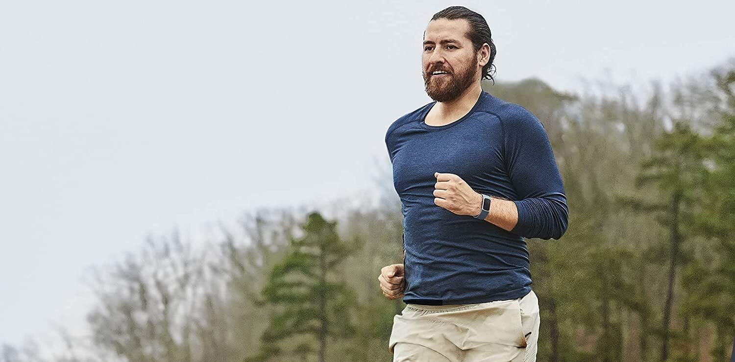 Man running with a fitbit on his wrist