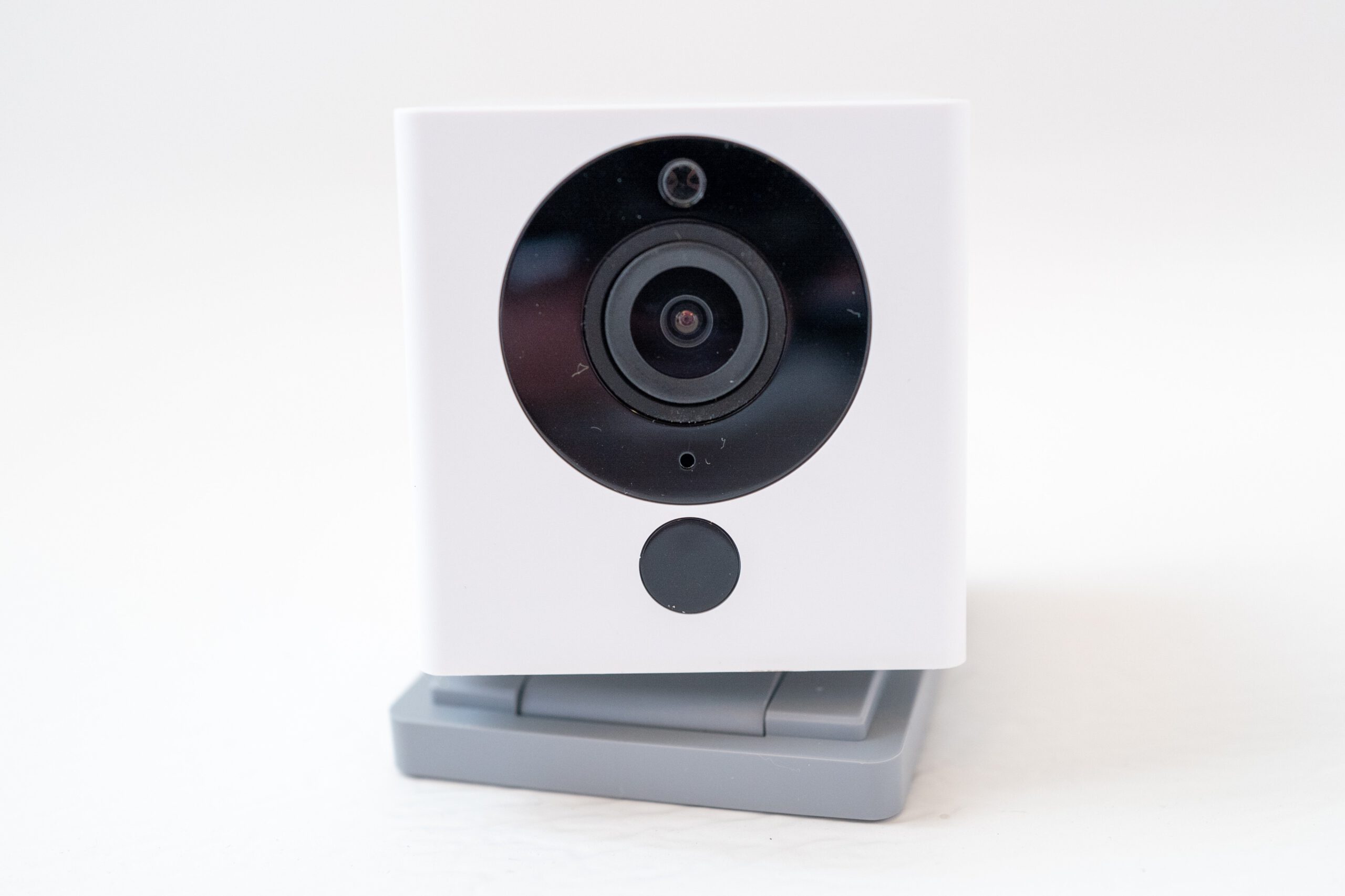 A Wyze camera in front of a white background.