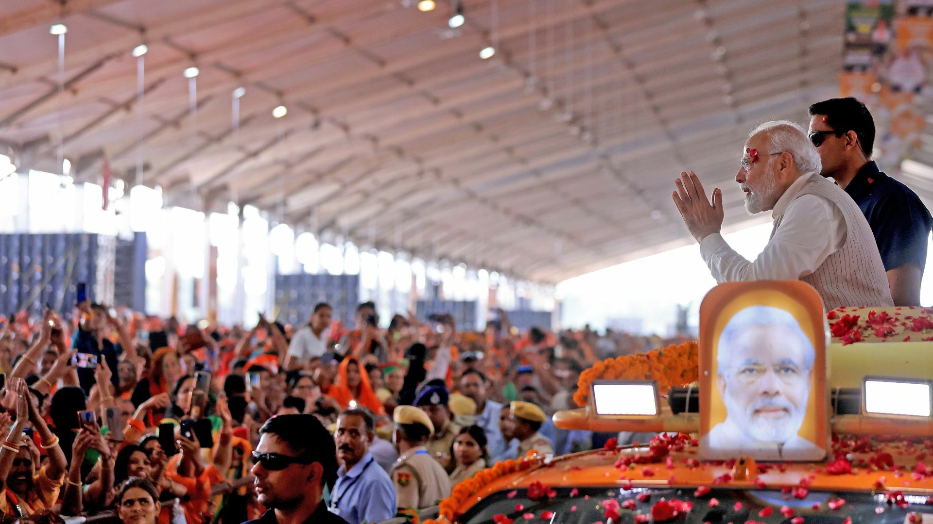 Prime Minister Narendra Modi exchanges greetings with a crowd in Jaipur.