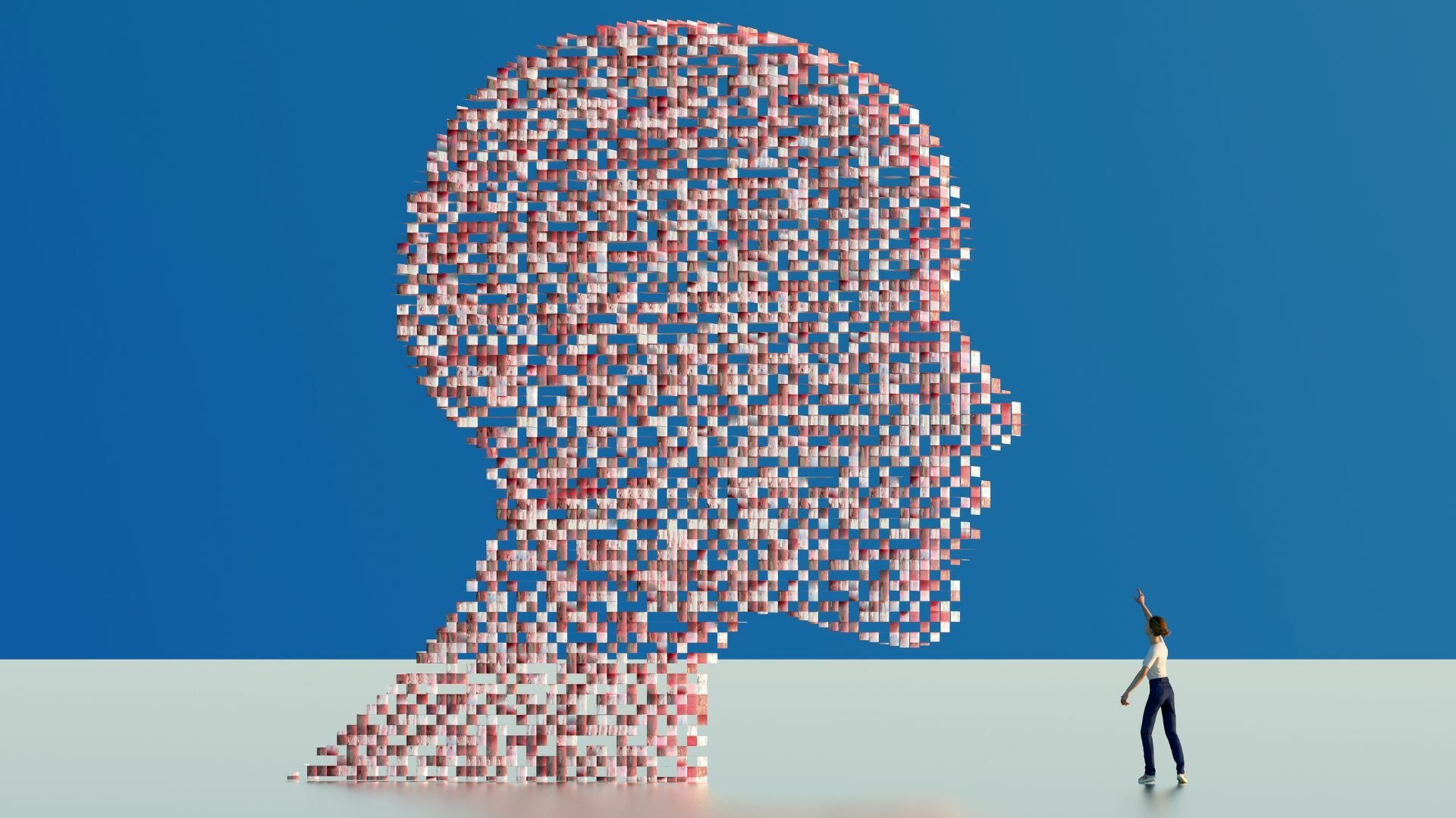 Pixelated human head as artificial intelligence, with a small human reaching towards it.