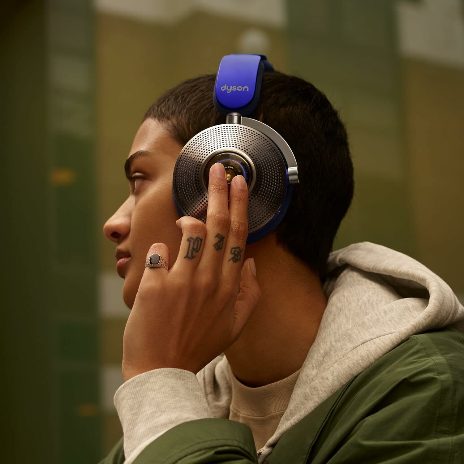 A preson wearing Dyson Zone noise canceling headphones 
