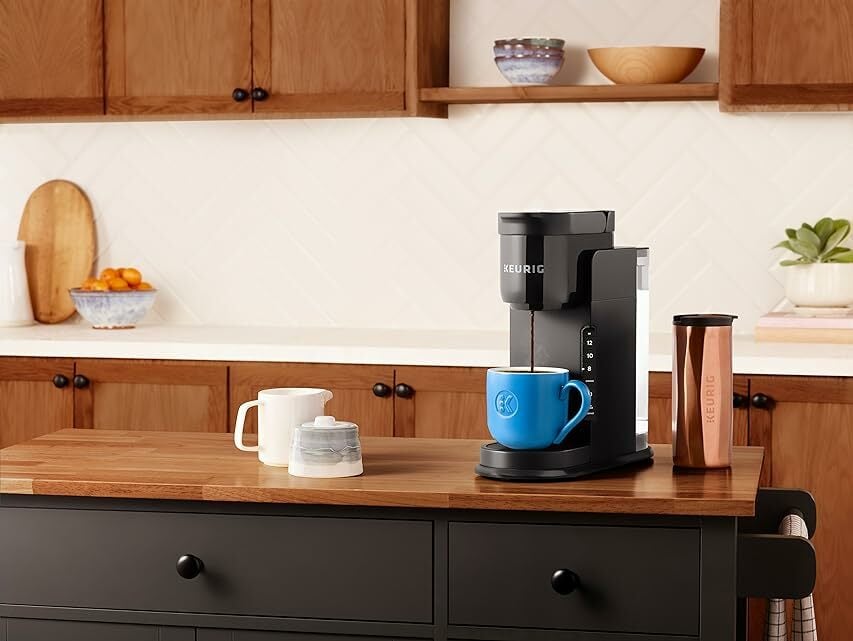 A Keurig is set up in a kitchen 