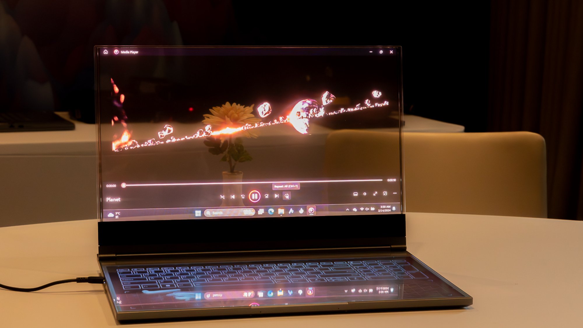 Lenovo transparent laptop showing a video