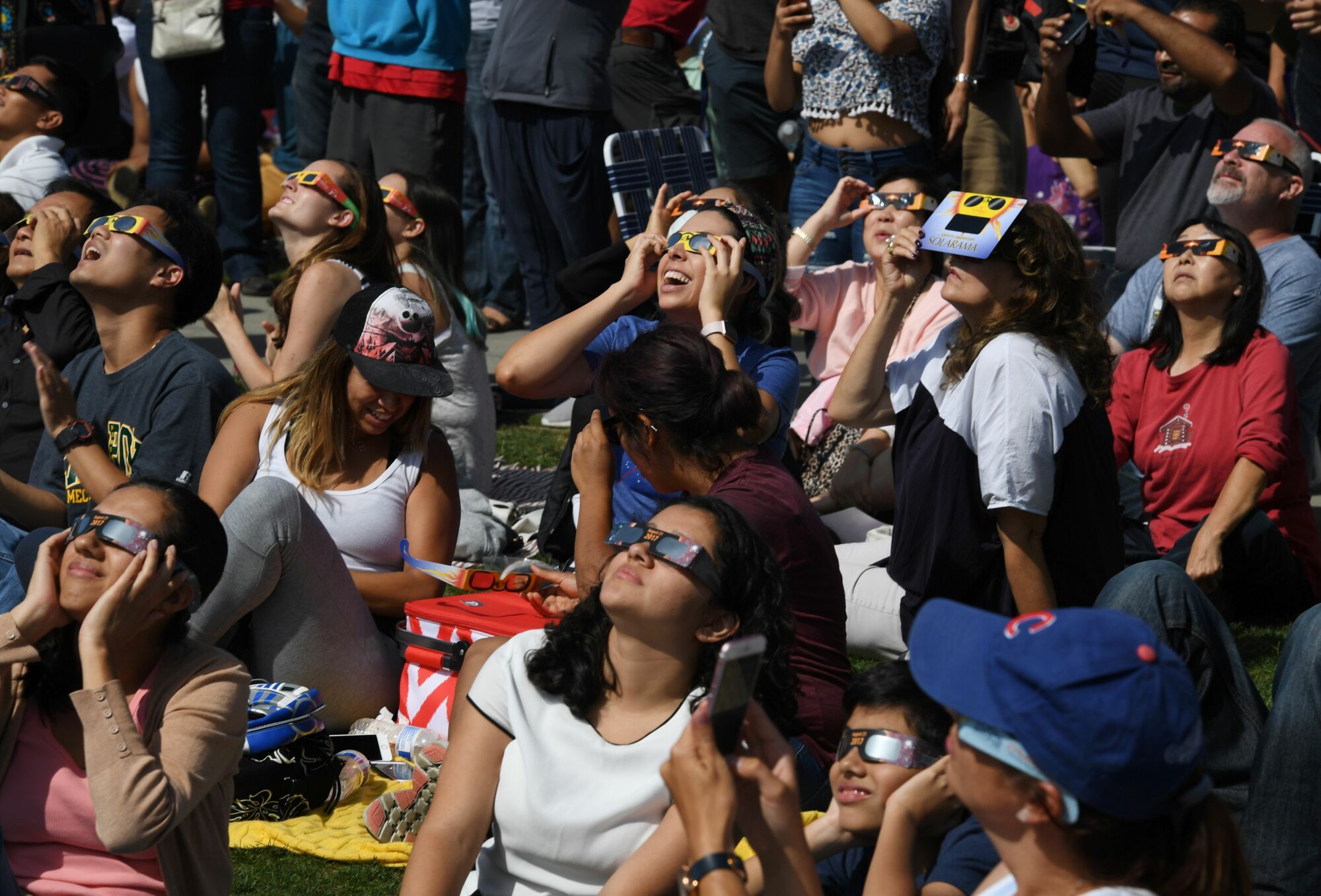Eclipse spectators wearing solar eclipse glasses