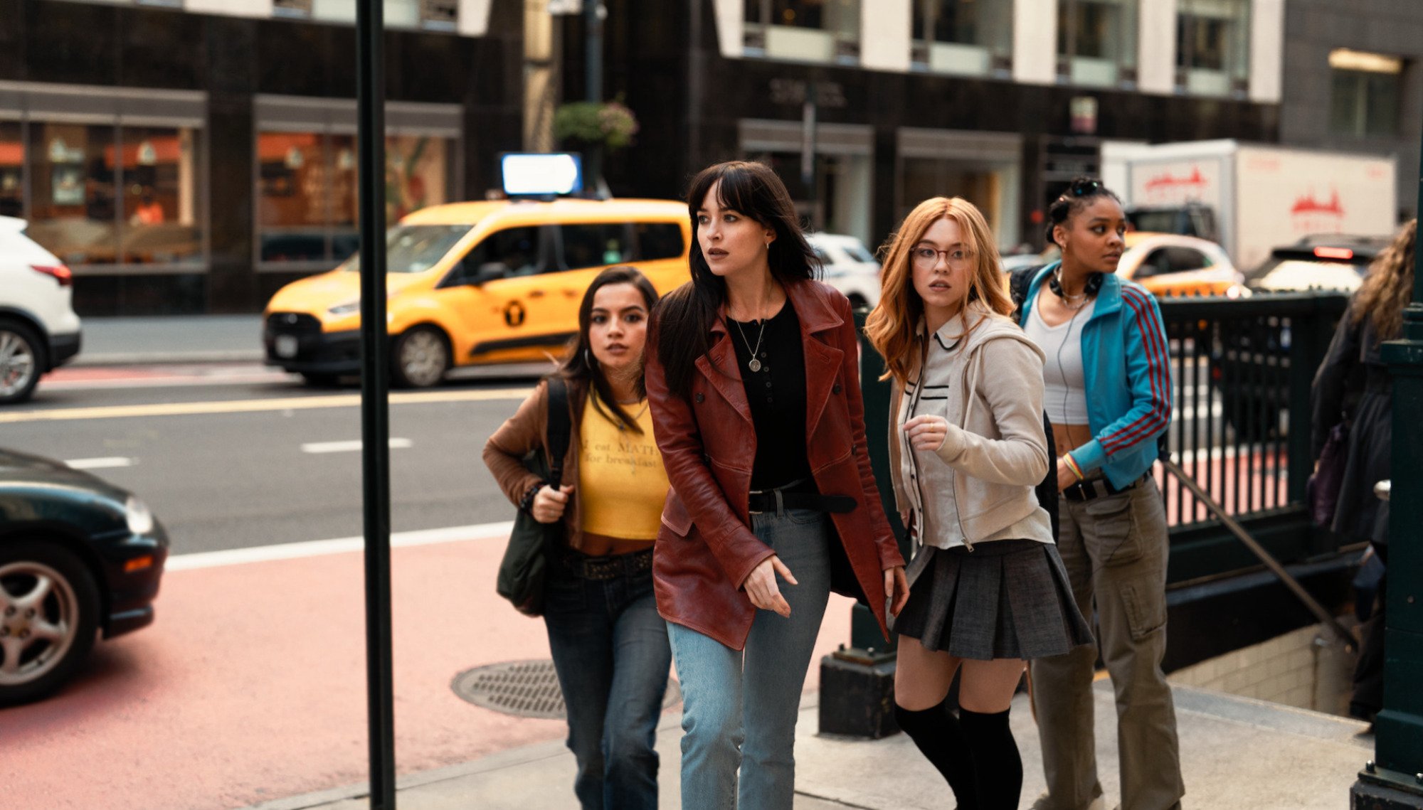 Four women look frantic on the streets of New York.
