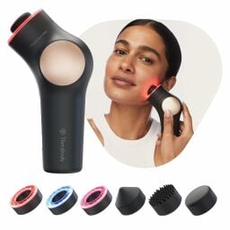 woman using Theraface PRO tool next to englarged version of face massager