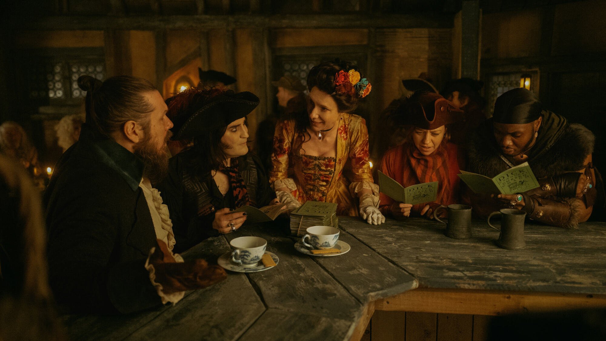 18th century characters sit around in a pub in the show "The Completely Made-Up Adventures of Dick Turpin""