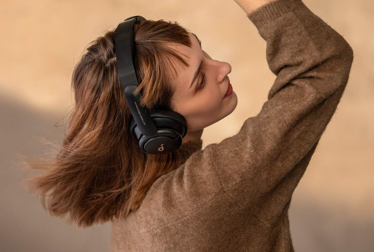 woman dancing with anker headphones on 