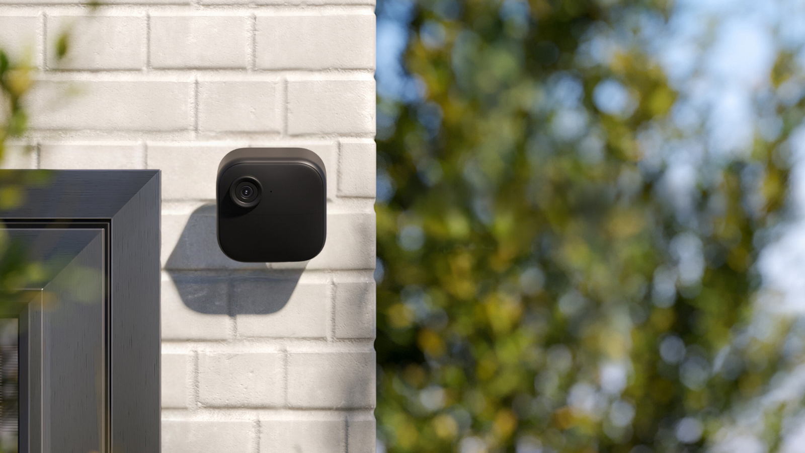 Blink outdoor security camera on wall outside home