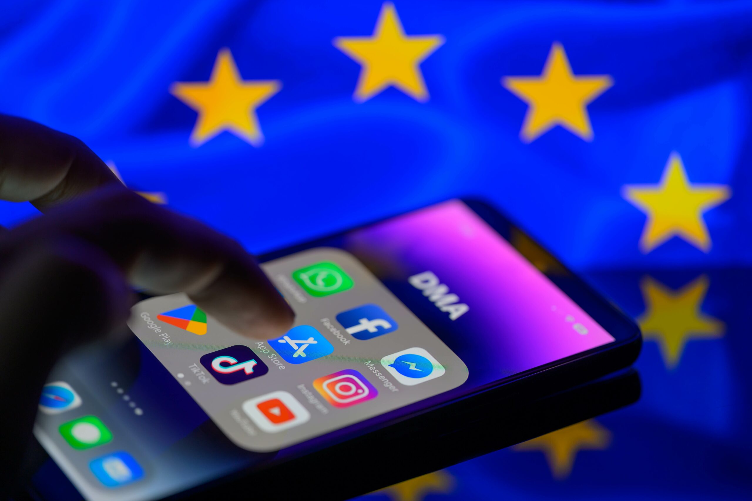 Apple iPhone with the EU flag in the background