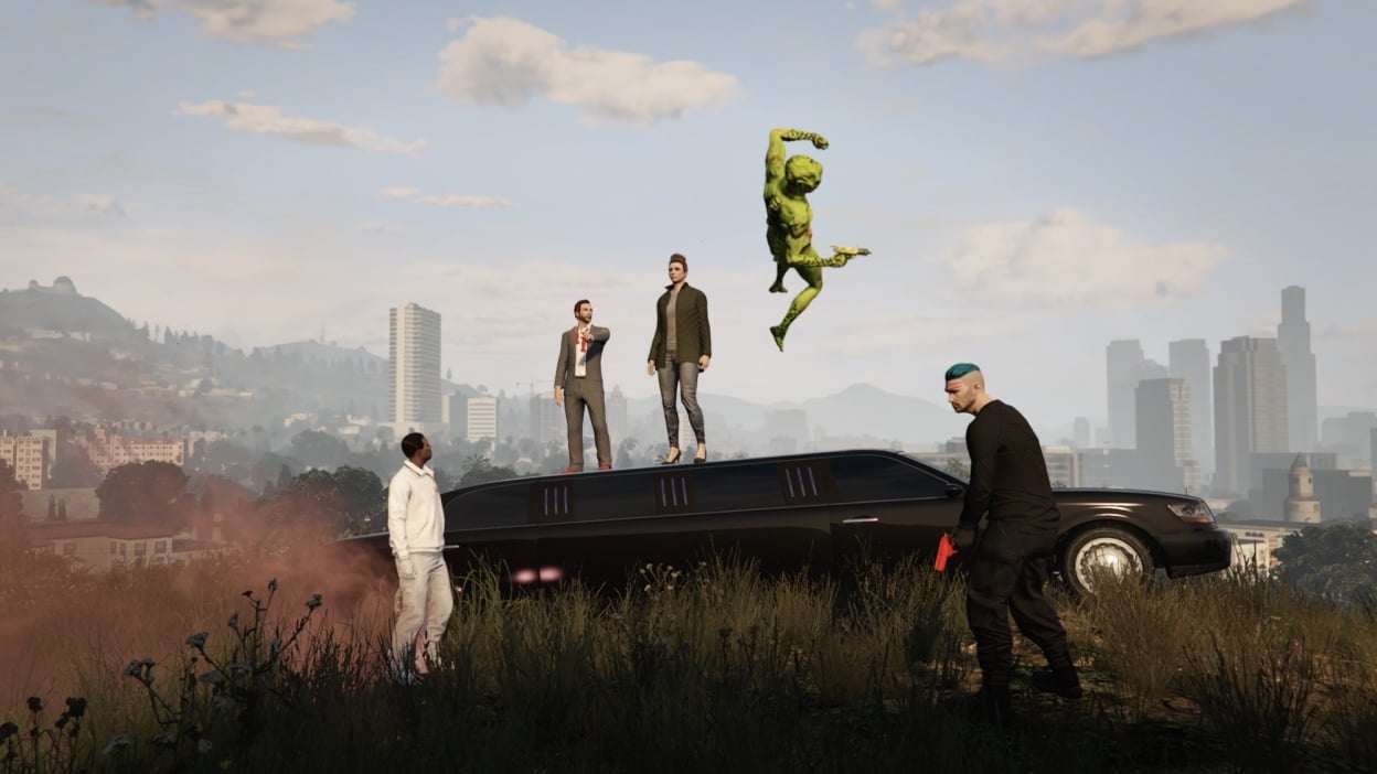 Two people stand atop a limo as a green alien jumps into the sky and one person on the ground looks at them while another, holding a red gun, looks into the distance. 