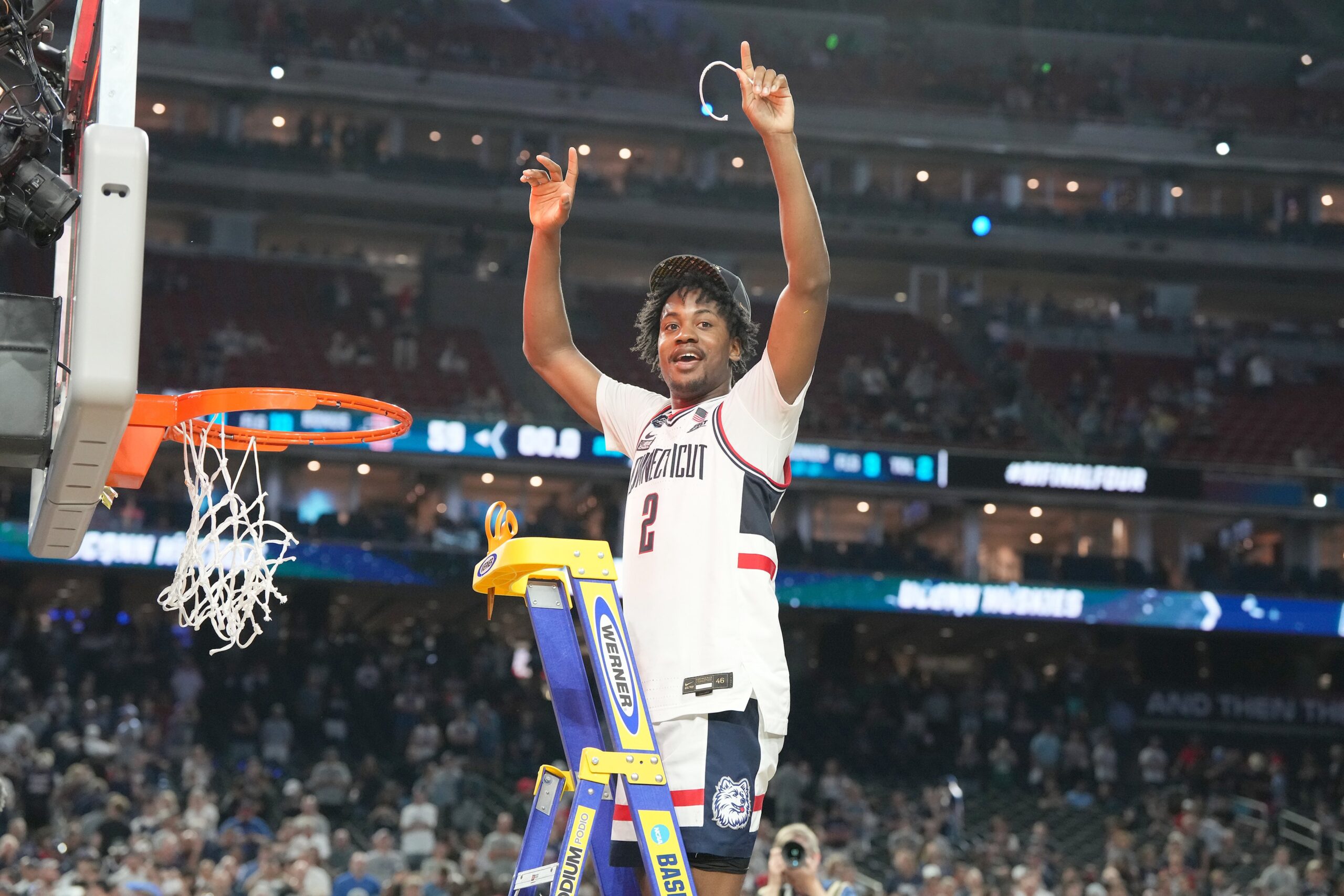 Tristen Newton #2 of the Connecticut Huskies cuts the net after winning the NCAA Men's Basketball Tournament championship game against the San Diego State Aztecs at NRG Stadium on April 3, 2023, in Houston, Texas. 