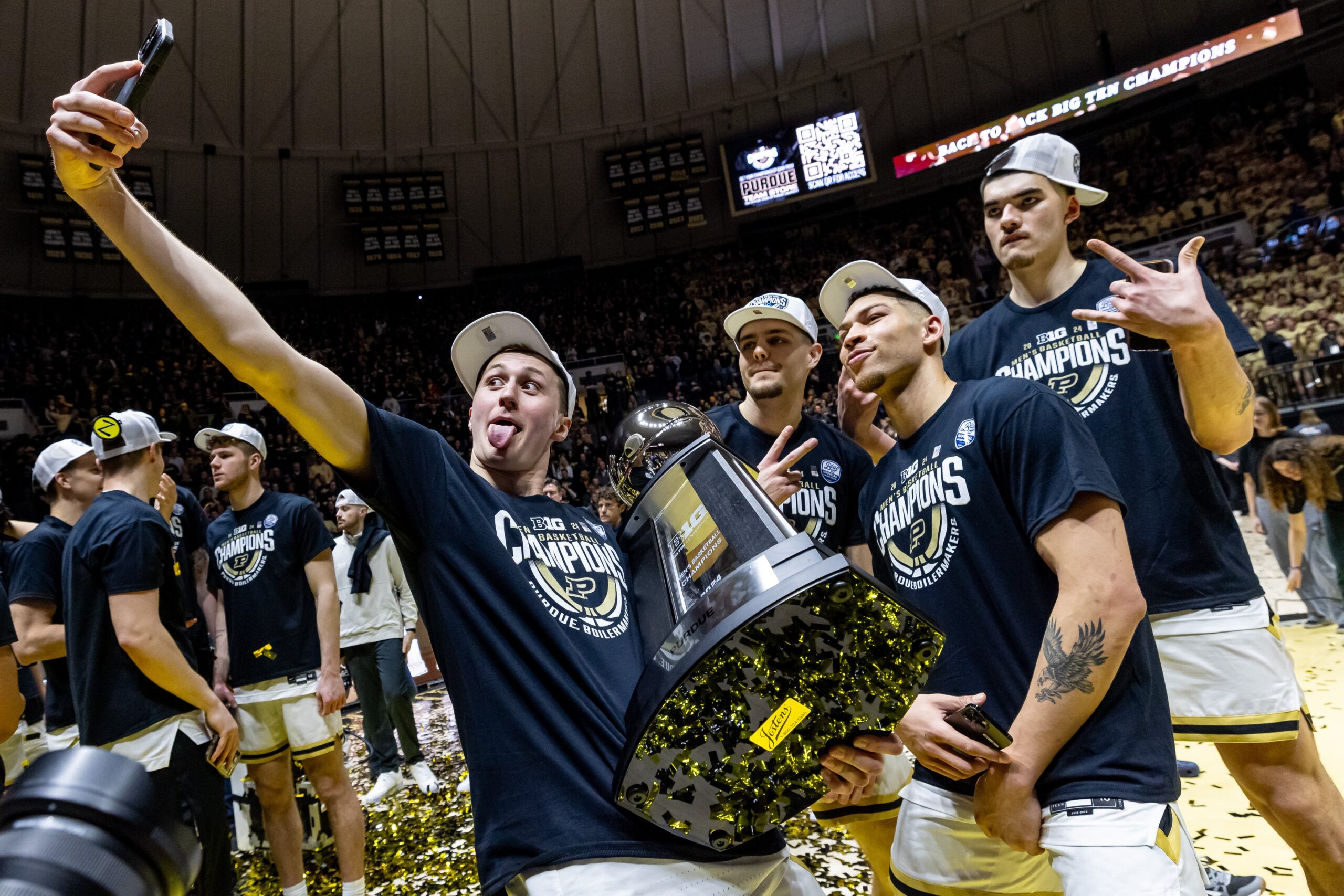 Fletcher Loyer #2, Camden Heide #23, Mason Gillis #0 and Zach Edey #15 of the Purdue Boilermakers celebrate after winning the Big Ten regular season championship over the Michigan State Spartans at Mackey Arena on March 2, 2024, in West Lafayette, Indiana.