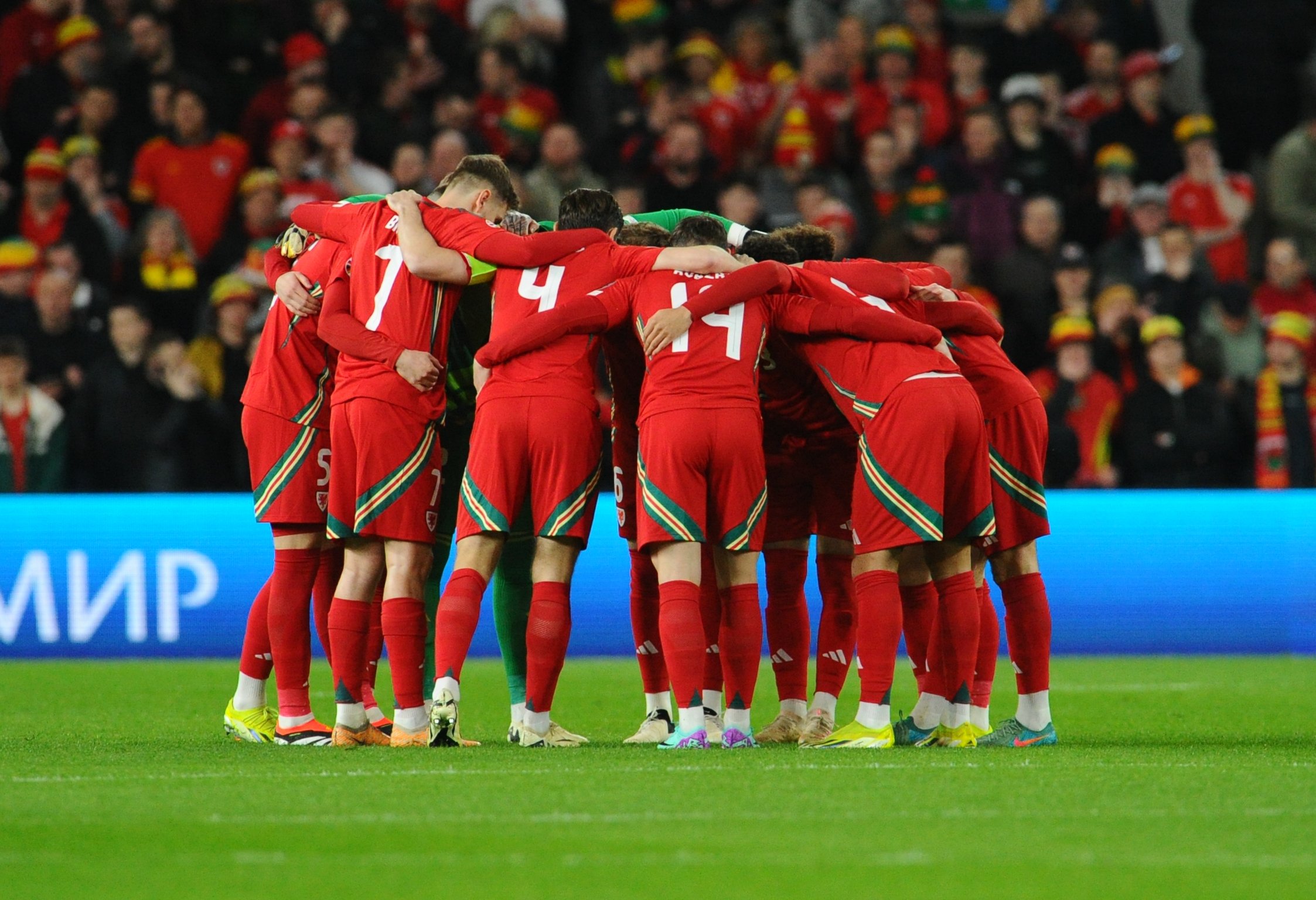 Wales have a team talk prior to kick off