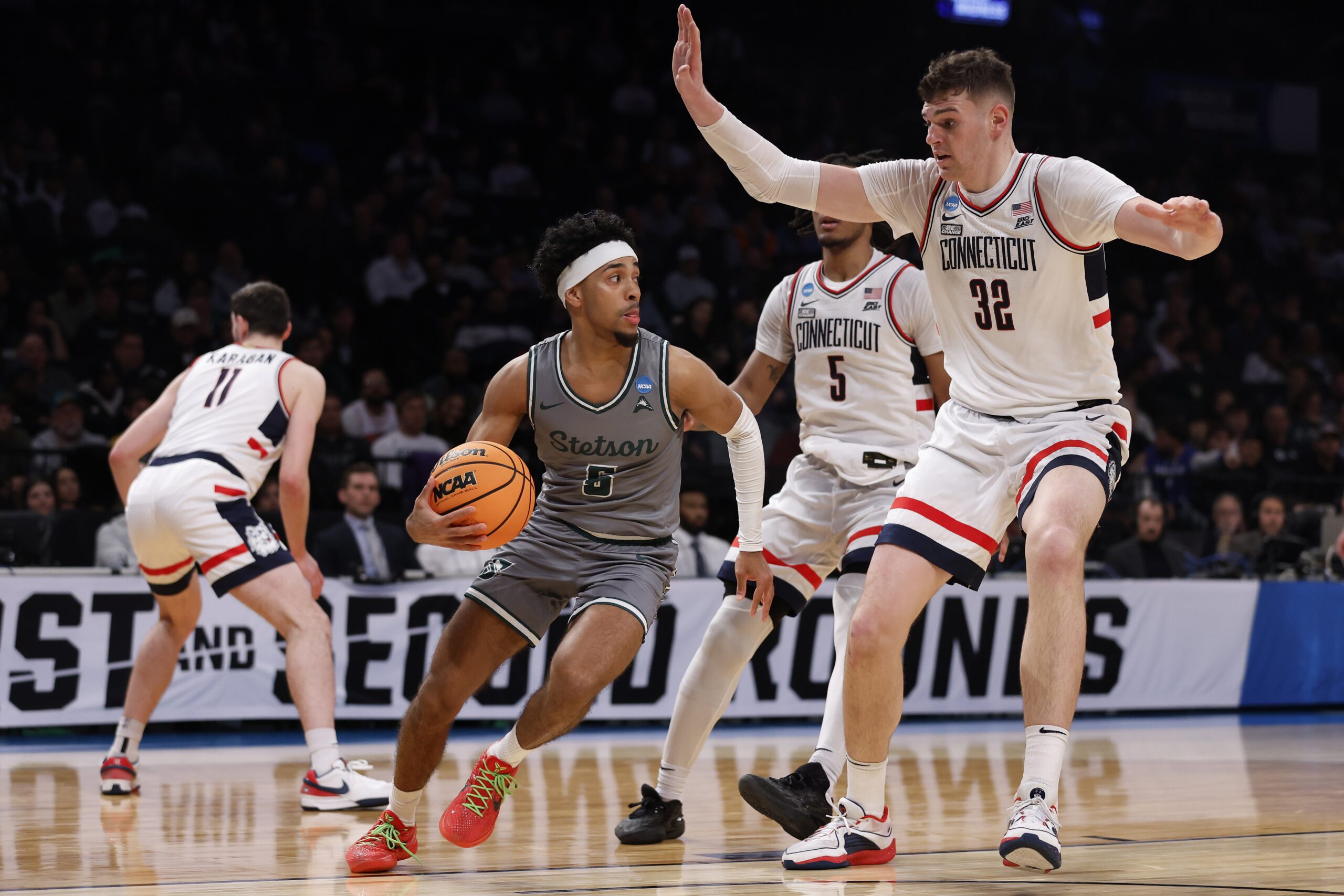 Jalen Blackmon #5 of the Stetson Hatters handles the ball in the second half against Donovan Clingan #32 of the Connecticut Huskies in the first round of the NCAA Men's Basketball Tournament at Barclays Center on March 22, 2024, in New York City. 