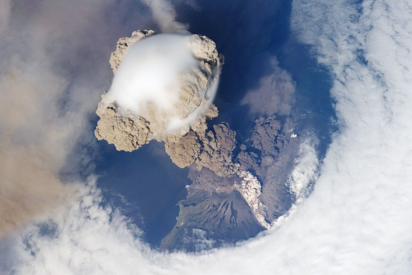 The Sarychev volcano in Russia erupting, as seen from the International Space Station. (It's not a supervolcano; such an eruption hasn't happened in modern history.)