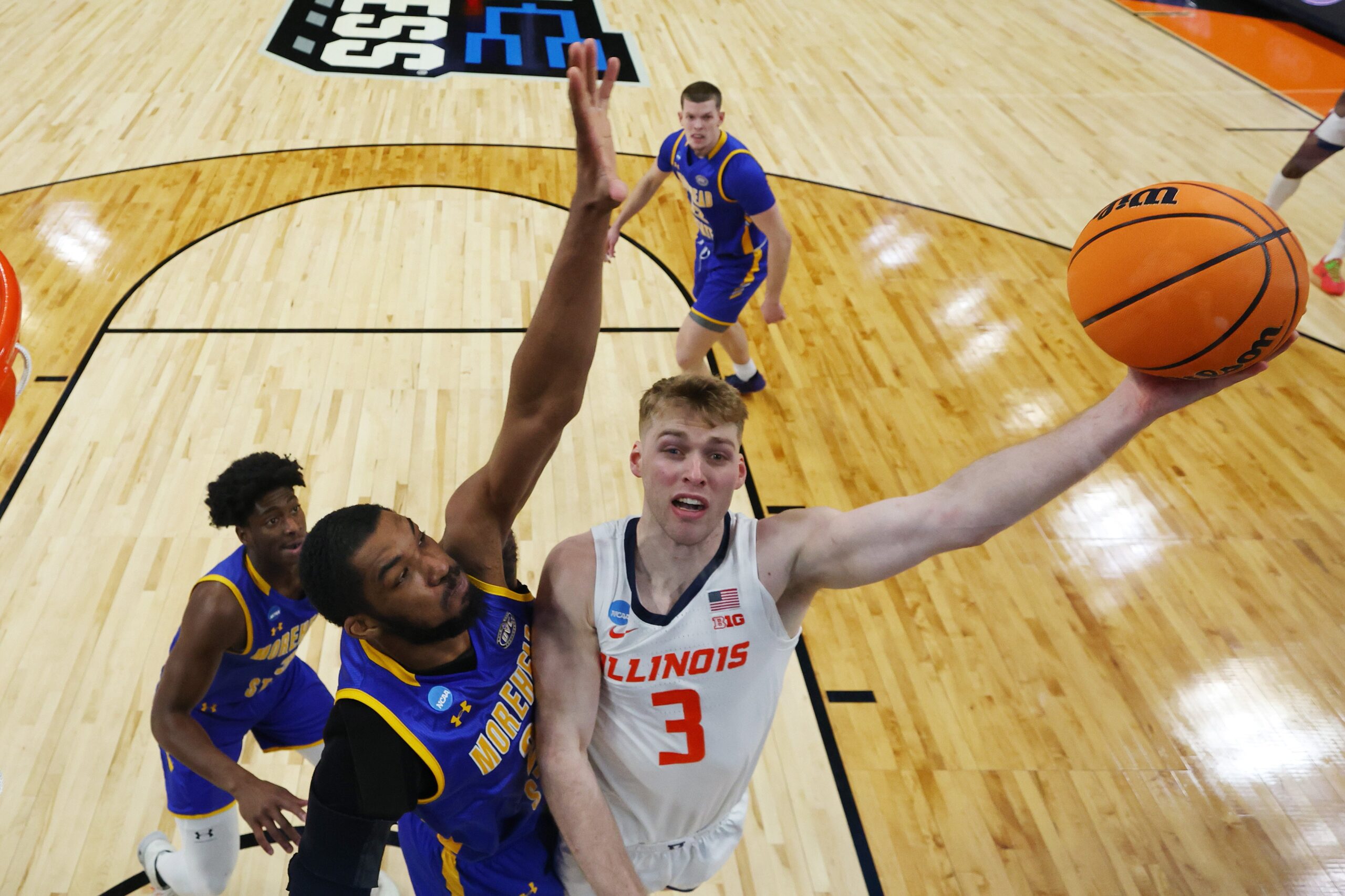 Marcus Domask #3 of the Illinois Fighting Illini shoots the ball over Dieonte Miles #23 of the Morehead State Eagles during the first half in the first round of the NCAA Men's Basketball Tournament at CHI Health Center on March 21, 2024, in Omaha, Nebraska.