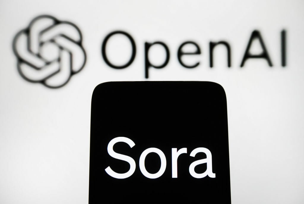 Sora logo on a smartphone in front of the OpenAI logo