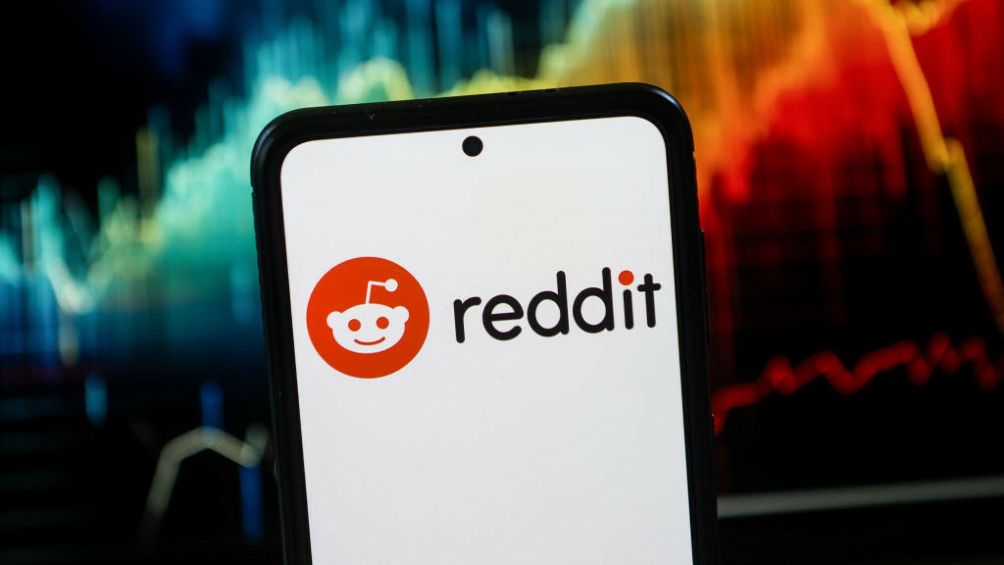 A Reddit logo seen displayed on a smartphone.