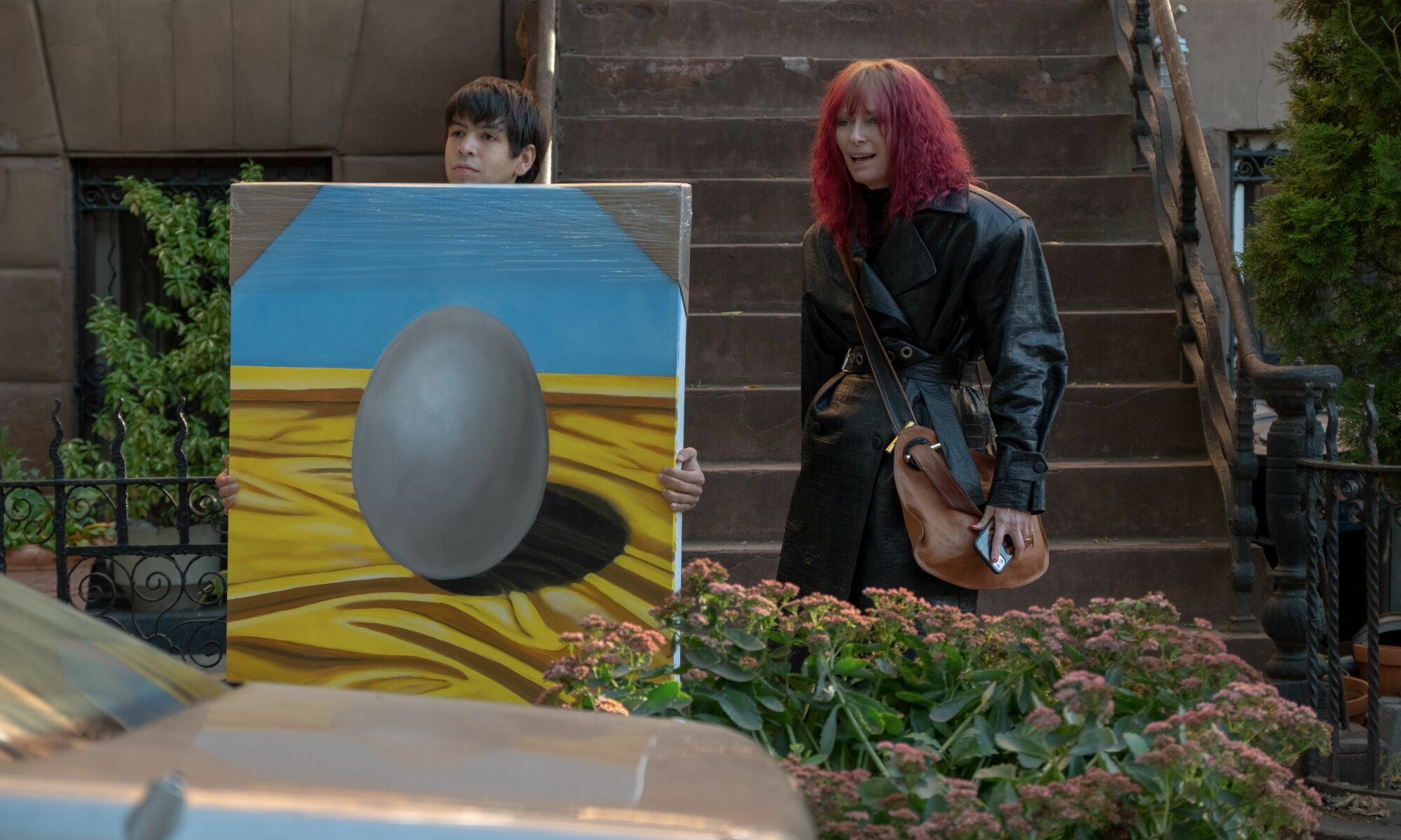 Tilda Swinton and Julio Torres with "Blue Egg on Yellow Satin" in "Problemista."
