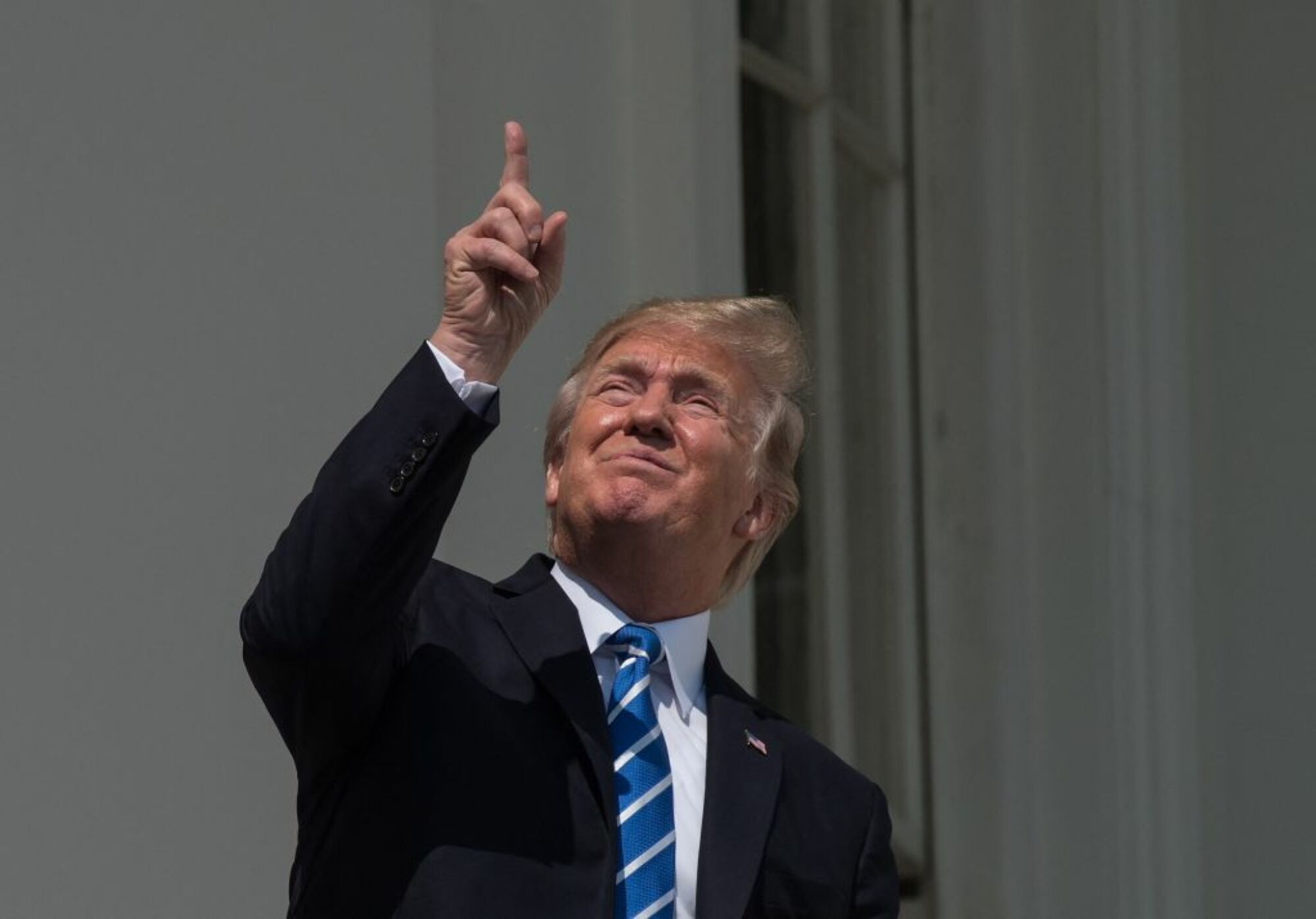 President Donald Trump looking at the sun
