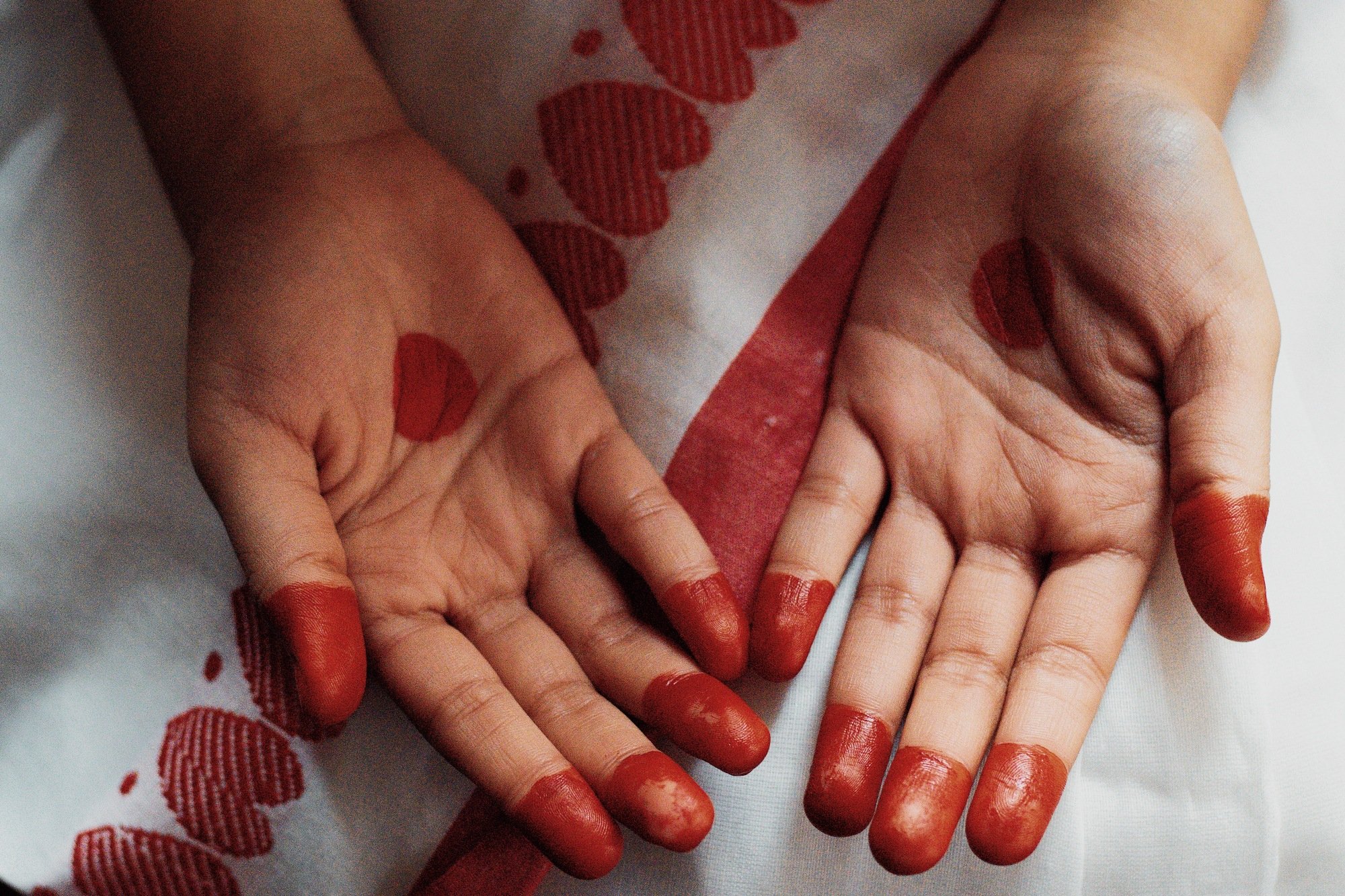 A shot of mehendi-stained hands. 