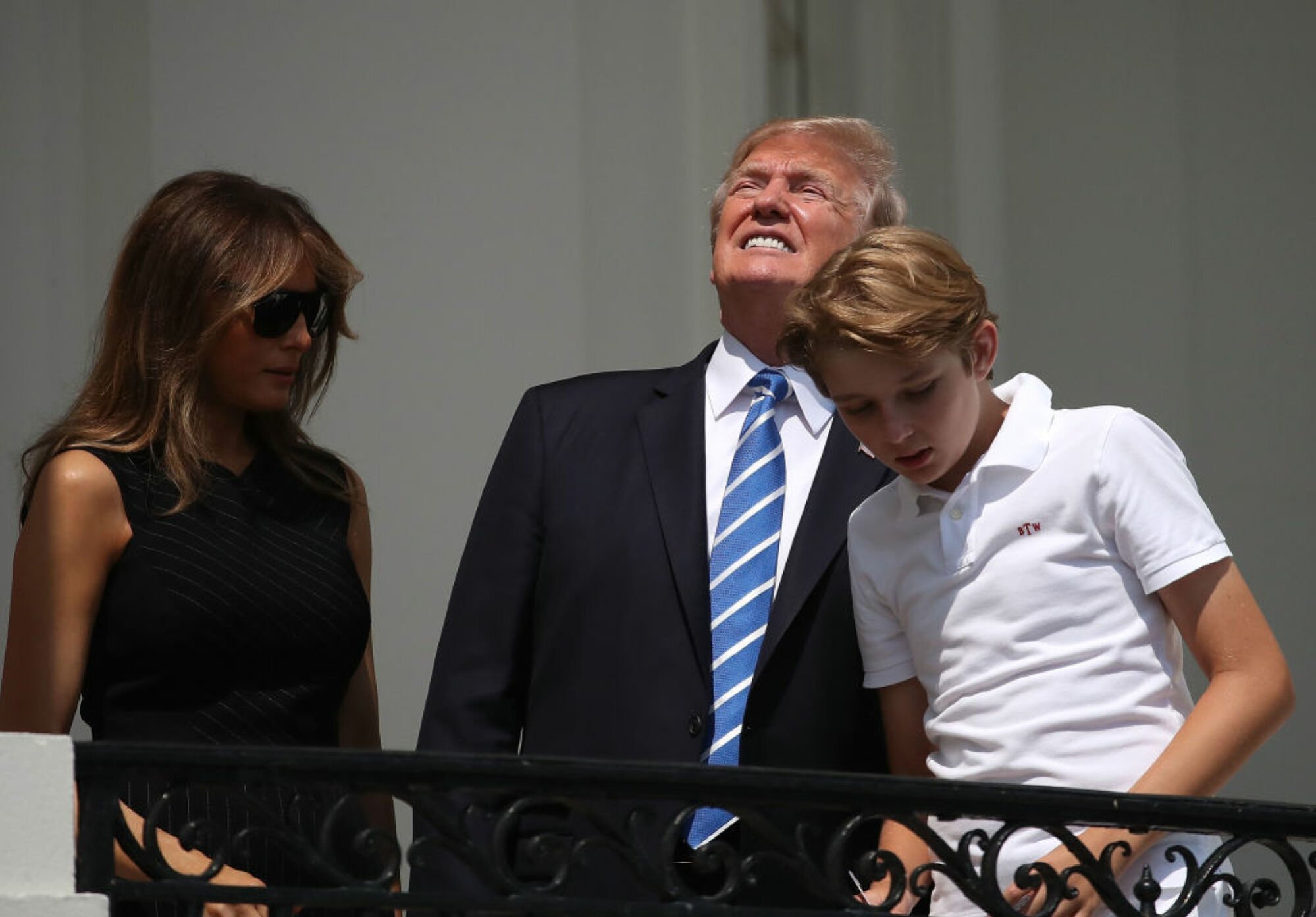 President Donald Trump squinting during the solar eclipse
