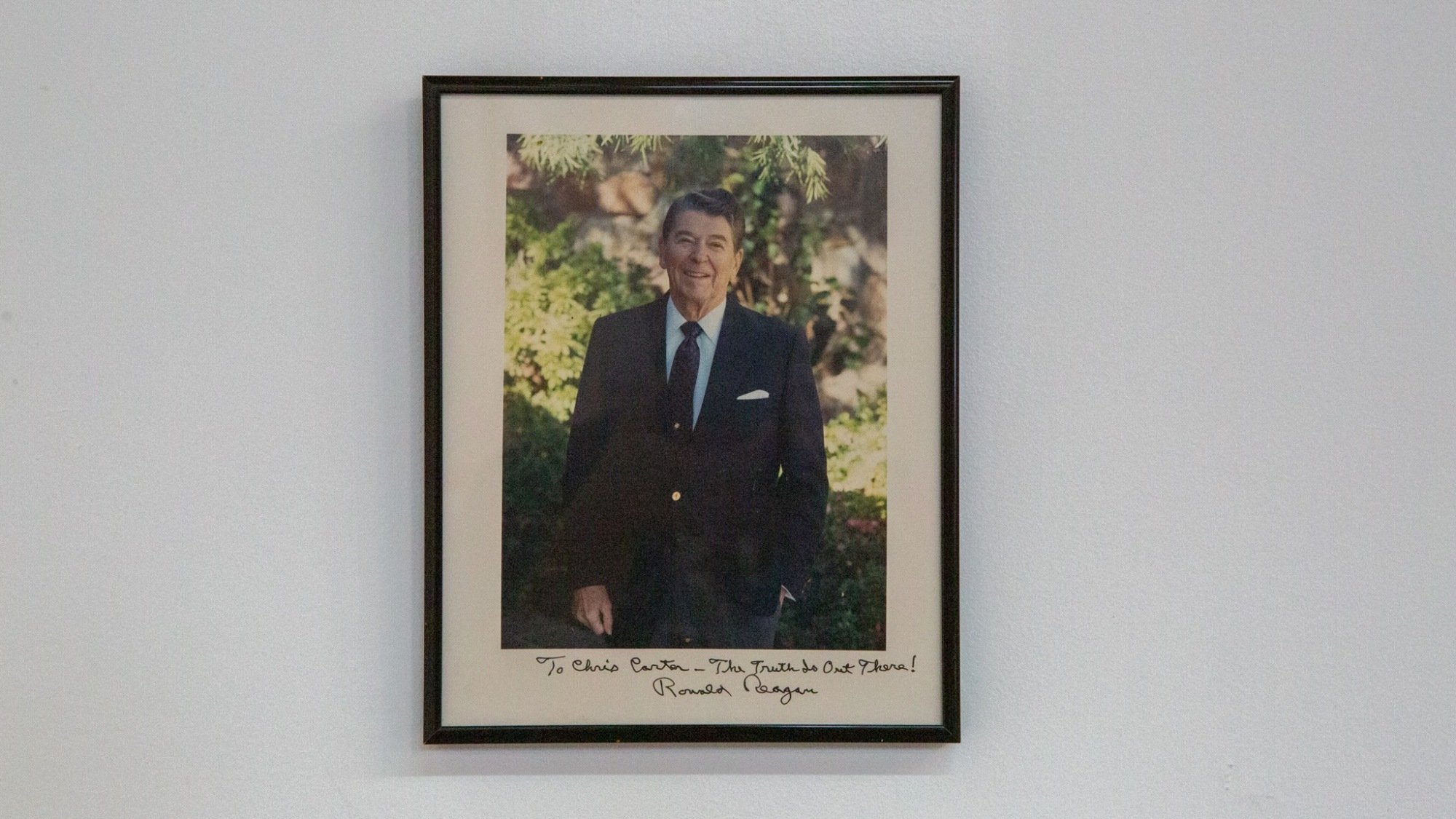 A framed photo of President Ronald Reagan. 