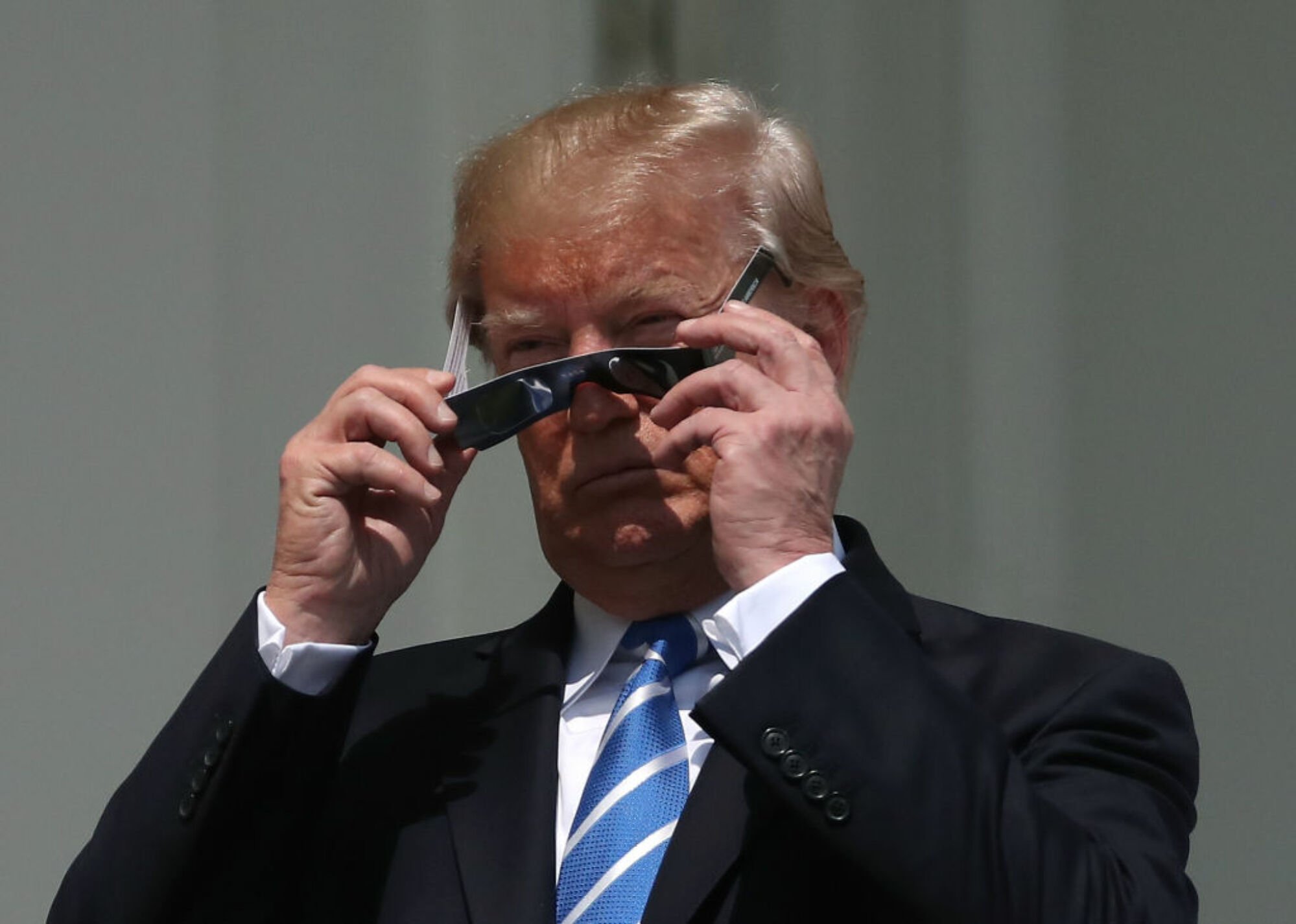 President Donald Trump putting on solar eclipse filters
