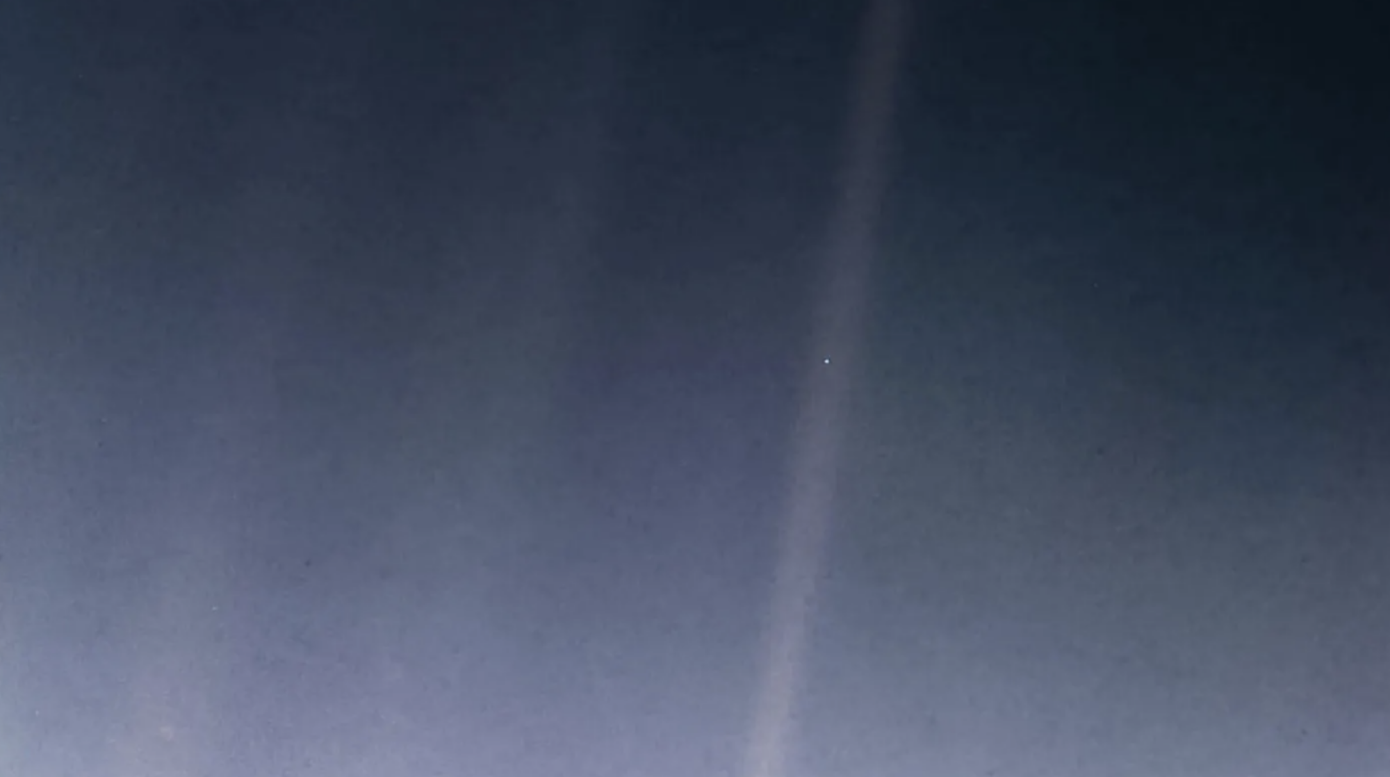 The "Pale Blue Dot," or Earth, captured by the Voyager 1 spacecraft.