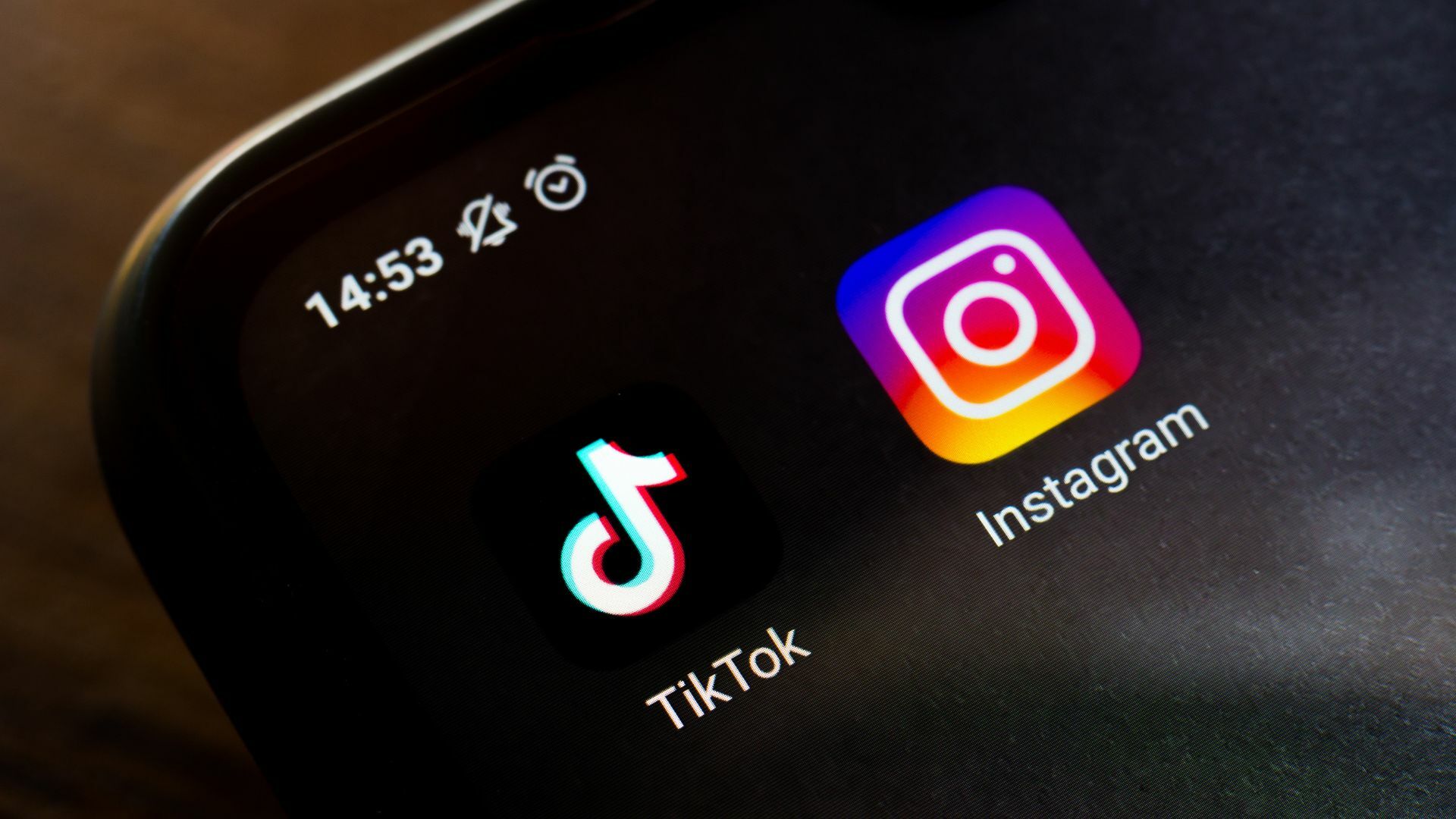 In this photo illustration a TikTok and an Instagram app seen displayed on a smartphone.