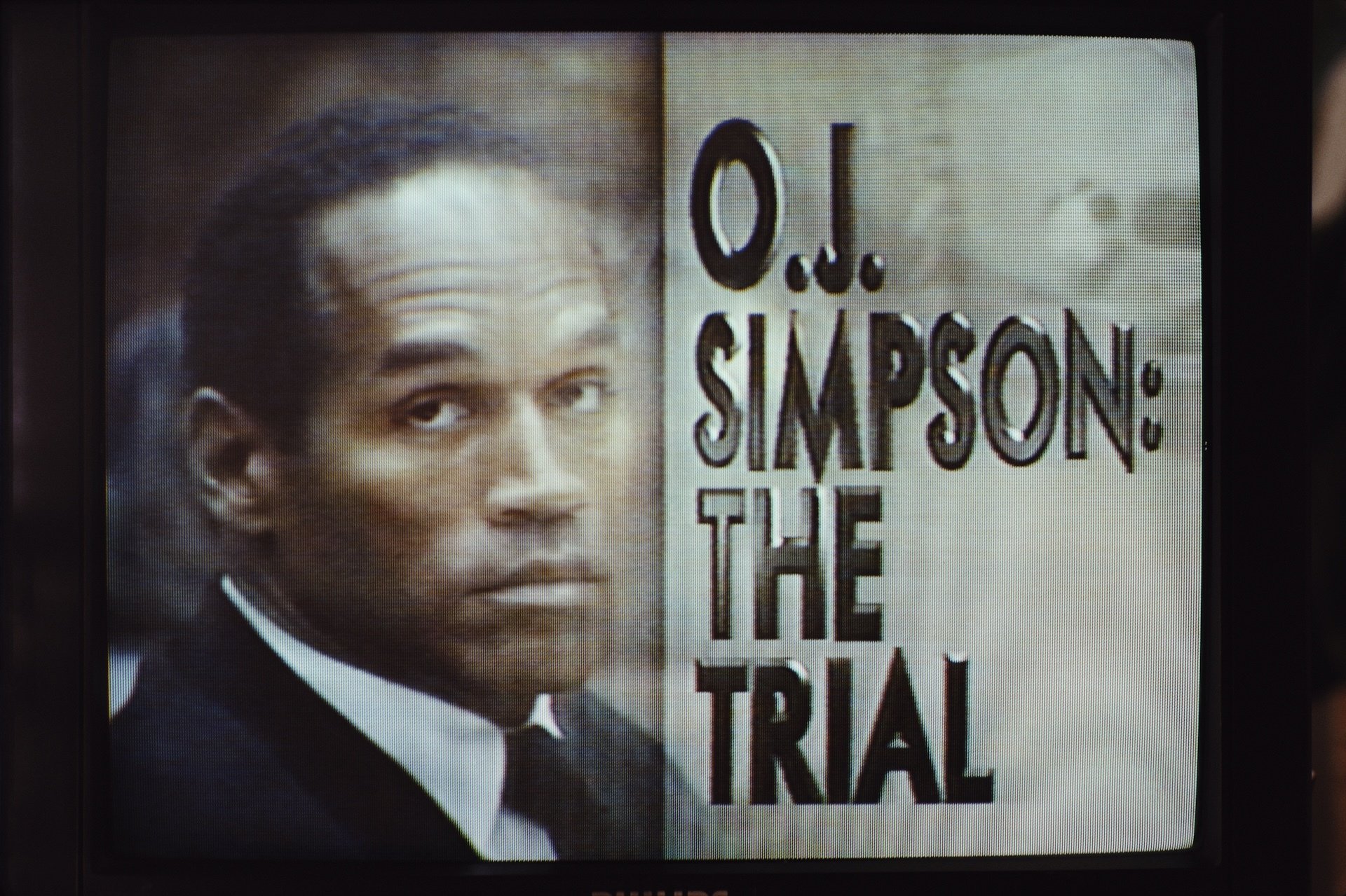 OJ Simpson on trial on a TV screen.